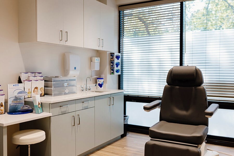 Clean, professional medical spa treatment room with neutral tones at Appel Wormer Esthetics in Charlotte